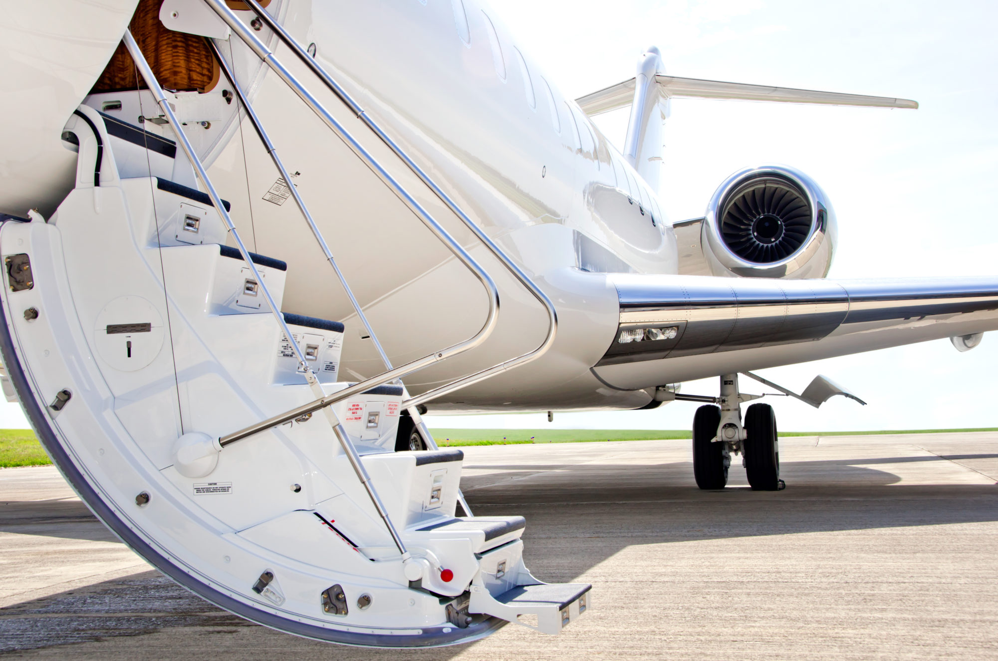 Stairs with jet engine on a private airplane - Bombardier